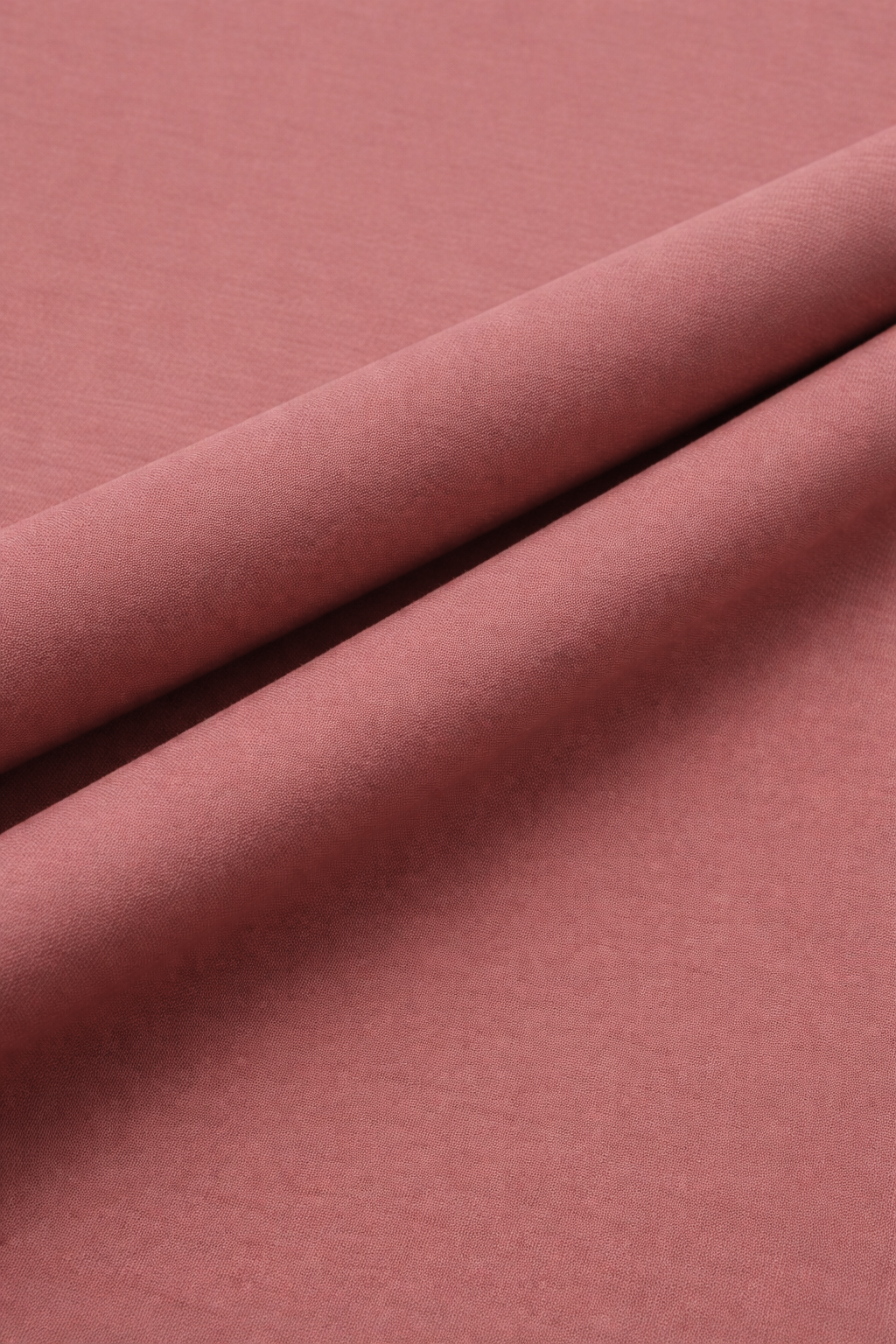 Close-up of cloral red fabric with a subtle texture