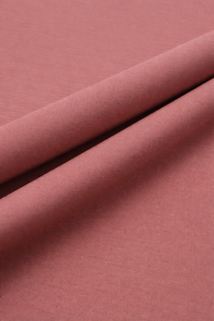 Close-up of cloral red fabric with a subtle texture