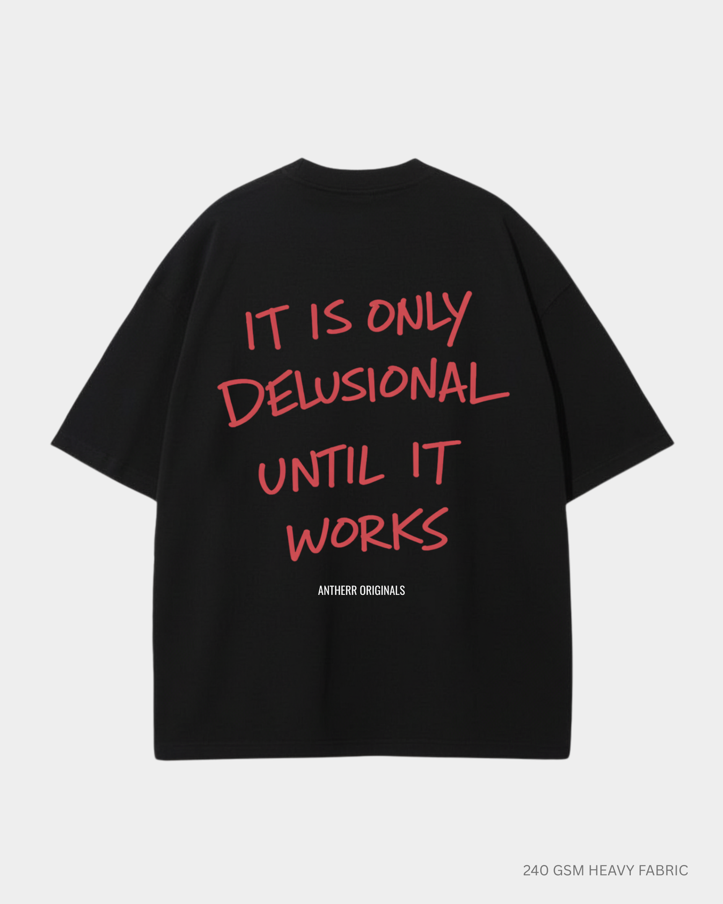 black oversized t shirt with it is only delusional until it works quote